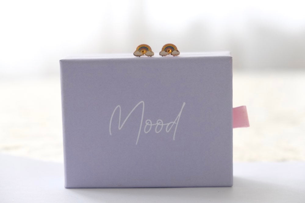 Purple box with 'Mood' branding and a pair of earrings 