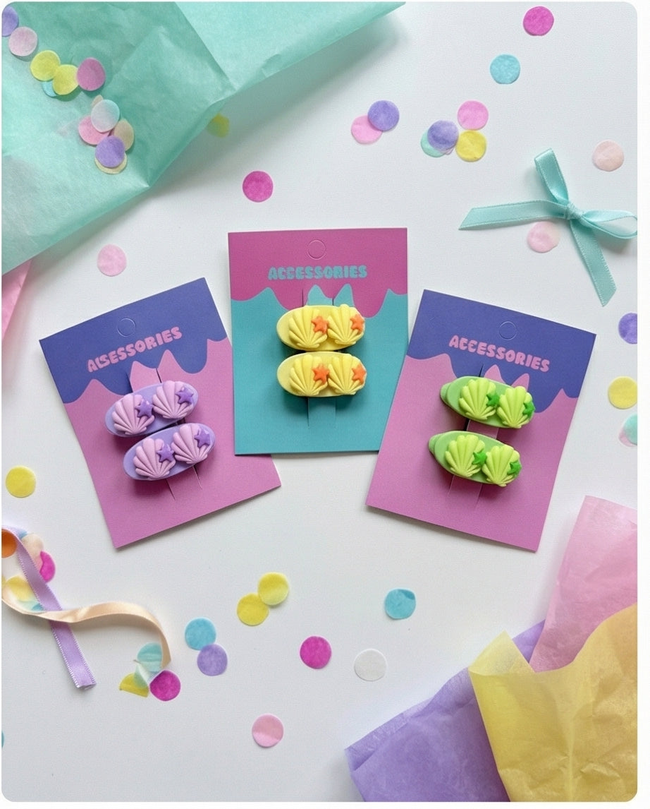 Colorful hair accessories on cards with confetti and ribbons on a white background